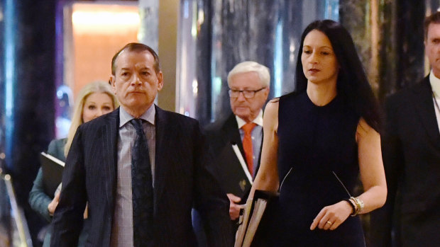 Crown Resorts executive chairman John Alexander (left) and company secretary Mary Manos arrive at the company's AGM on Thursday. 