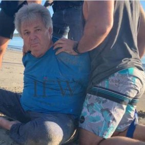 Peter Foster arrested on a Queensland beach in 2020.