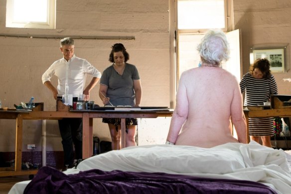 Steven Alderton, Director of the National Art School, with students during a life drawing class in Sydney.