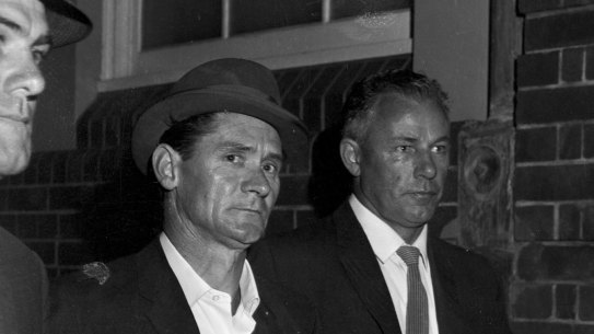 Melbourne prison escapee Ronald Ryan being taken to police headquarters in Sydney after his recapture on January 5, 1966.