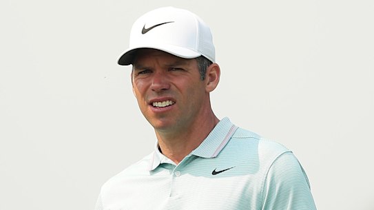 Paul Casey looks on as dense smoke from bushfires fills the sky.