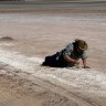 Sophie Cape, in the pose of The Dying Gladiator collecting salt.