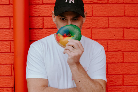 Michael Shafran with a rainbow bagel from Brooklyn Boys.