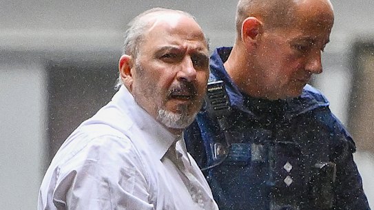 Tony Mokbel being led into court on Monday.