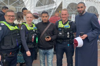 Local police members with Imam Alaa Elzokm, far right and an Egyptian consulate representative,  centre, at Elsedeaq Mosque in Heidelberg Heights on Monday.
