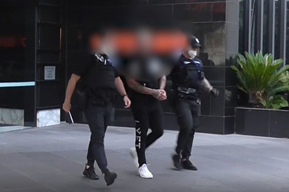 Police arrest Toby Mitchell, 47, in Southbank on Tuesday.