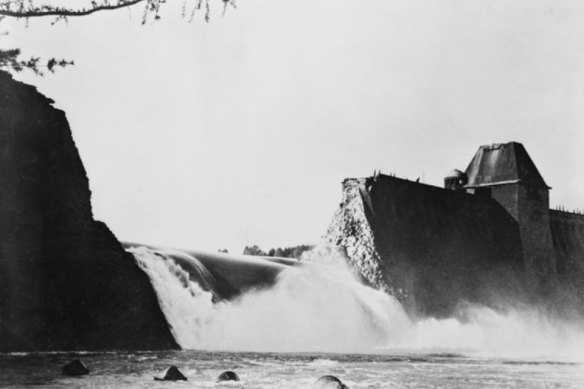 Water pours from the Moehre Dam six hours after the successful attack by the RAF in 1943 during World War II.