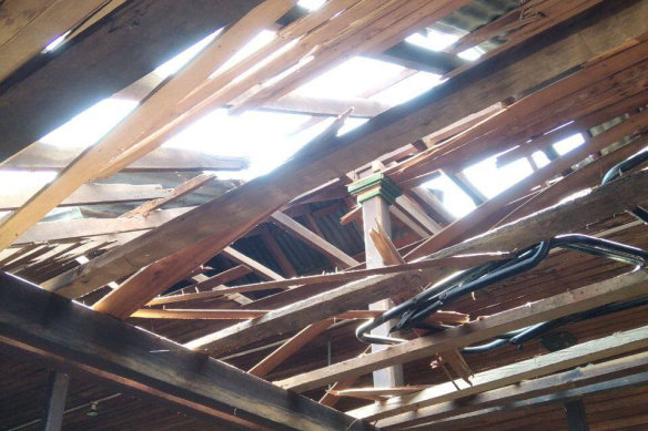 A damaged rooftop and broken wooden ceiling let sunlight into a middle school in Let Yet Kone village.