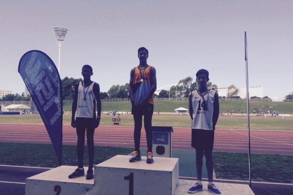 Joseph-Aukuso Suaalii (top step) after winning the NSW under 12s high jump competition.