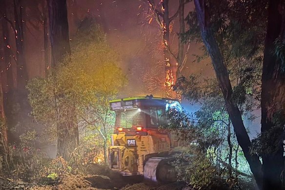 Firefighters battling the Carlisle River bushfire on Saturday. 