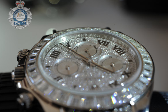 The AFP has seized diamond-encrusted Rolexes and designer handbags worth millions.