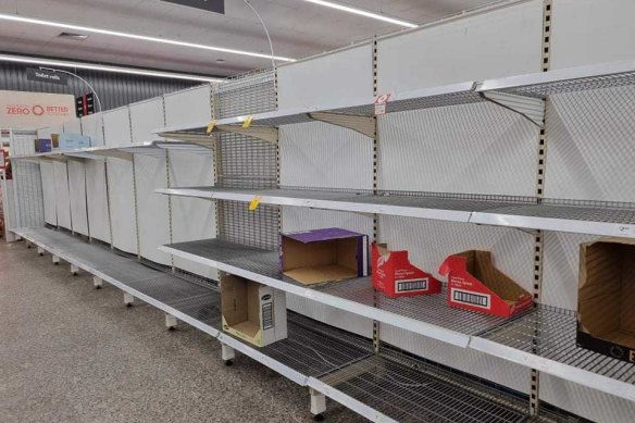 Bare shelves at a Coles supermarket in Brisbane.