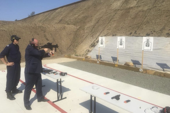 Police Minister David Elliott at the opening of a rifle range in 2018.