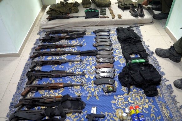 Weapons and other equipment that Israel’s army says it found at Al Shifa Hospital complex in the Gaza Strip.