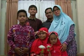 Dita Oeprianto and his wife Puji Kuswati with their four children. All six family members were involved and died in the suicide attacks. 