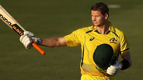 Steve Smith celebrates scoring a century during game three of the one -day international series against New Zealand in Cairns on Sunday.