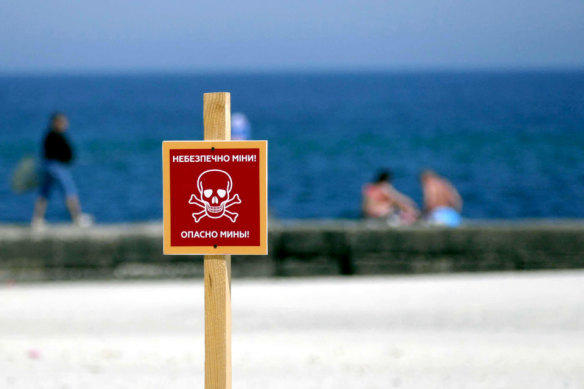 The ‘Danger Mines’ warning sign is pictured at a local beach in Odesa, southern Ukraine.
