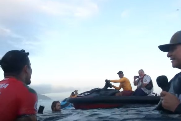 French Polynesia president Moetai Brotherson on a jet ski moments after Italo Ferreira (left) wins the Tahiti Pro at Teahupo’o.