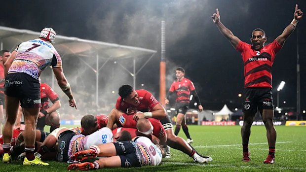 Sevu Reece of the Crusaders celebrates after Tamaiti Williams scores against the Reds.