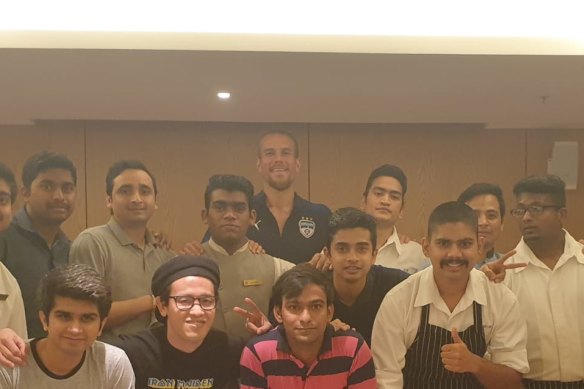 Erik Paartalu (rear) with the players and staff from Bengaluru in hotel quarantine