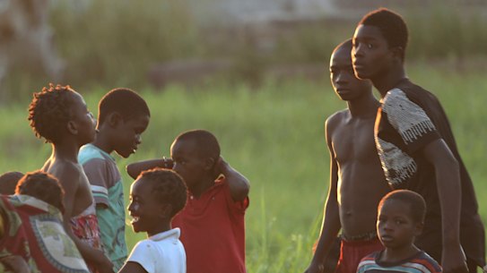 Children play at a watering point in Beira, Mozambique, Monday April, 1, 2019. 