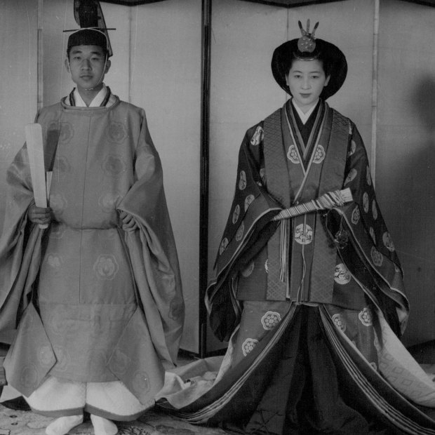 Akihito and Michiko in their wedding costumes (his was red, hers was orange).  