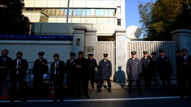 Japanese police guard the headquarters of the pro-Pyongyang General Association of the Korean Residents in Japan in Tokyo during protests against North Korea. 