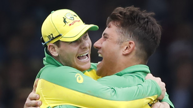 Marcus Stoinis and Steve Smith celebrate a wicket.