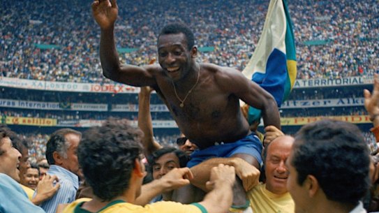 Pelé is hoisted on the shoulders of his teammates after Brazil won the 1970 World Cup.