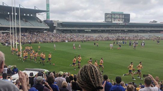 West Coast fans attend Eagles training at Subiaco Oval before Saturday's grand final at the MCG.
