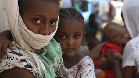 Refugees from the Tigray region of Ethiopia region wait to register at the UNCHR center at Hamdayet, Sudan.