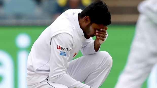 Despondent: Dhananjaya de Silva after dropping Australian century-maker Travis Head.