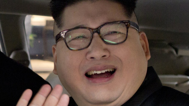 Deported: Howard X, an Australian impersonating North Korean leader Kim Jong-un, waves.