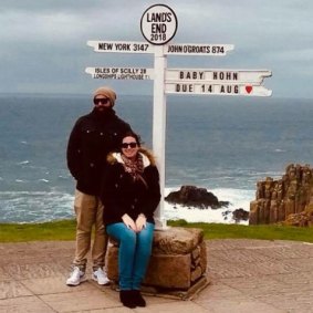 Charley Anning and her partner announcing their pregnancy in Lands End in England.