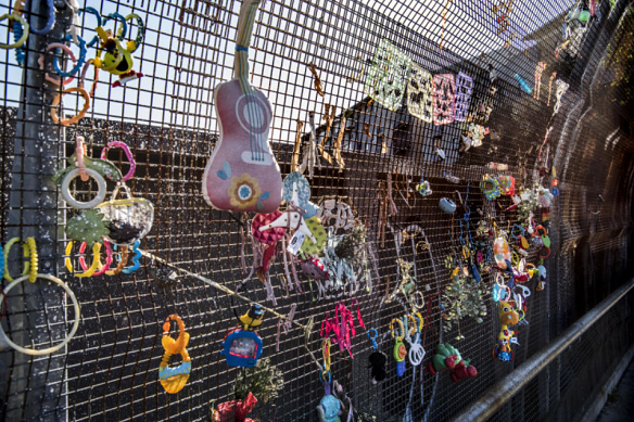 Steven Siewert related these toys left on a bridge to a child moving onto the next stage of their life.
  