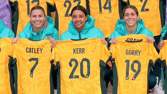 The Matildas pose with their World cup jerseys at Federation Square