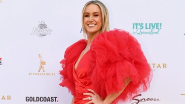 Leila McKinnon in a fire-engine red gown arrives at the 2019 Logie Awards at The Star Gold Coast.