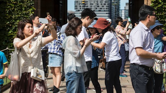 Chinese tourists on a tour of Sydney University.