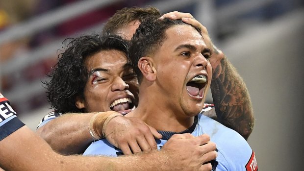 Latrell Mitchell celebrates his first try in a stirring comeback for NSW.