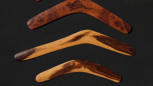 The top boomerang is fake, and of the type commonly sold in souvenir stores. The bottom two are genuine boomerangs, by Rolley Mintuma at Maruku Arts, NT. (File photo, not related to the recent Queensland crackdown.)