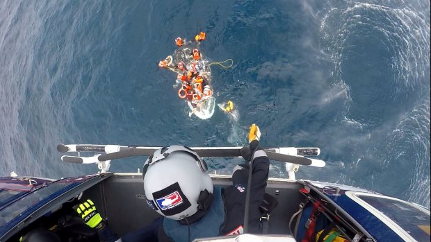 The RACQ Capricorn Rescue helicopter winched one person to safety from the sinking dinghy.