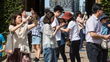 Chinese tourists on a tour of Sydney University.