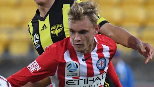 City's Nathaniel Atkinson battles Liberto Cacace of the Phoenix.