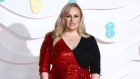 Actress Rebel Wilson poses for photographers upon arrival at the Bafta Film Awards, in central London, Sunday, Feb. 2 2020. (Photo by Joel C Ryan/Invision/AP)