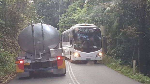 A water carrier passes a tourist bus on Tamborine Mountain. Photo courtesy of Save Our Water - Tamborine Mountain.