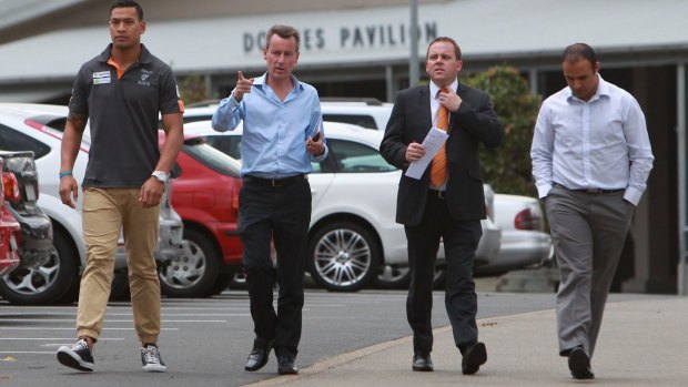 Happier times: Folau, left, and Moses, far right, after announcing an end to Folau's time with the GWS Giants in 2012.
