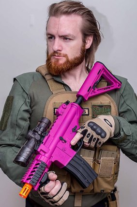 Brad Towner with an 'M4 Pink Commando' gel gun blaster. Picture supplied.
