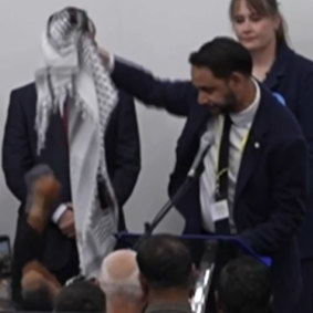 Leicester South MP winner Independent candidate Shockat Adam holds up the Palestinian keffiyeh as he celebrates. “This is for Gaza.”