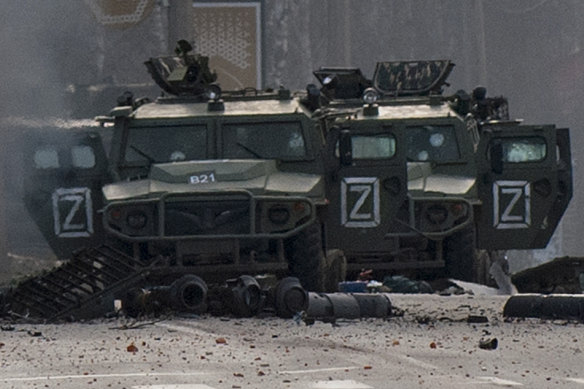 Russian army vehicles marked with “Z” stand abandoned after fighting in Kharkiv on February 27.