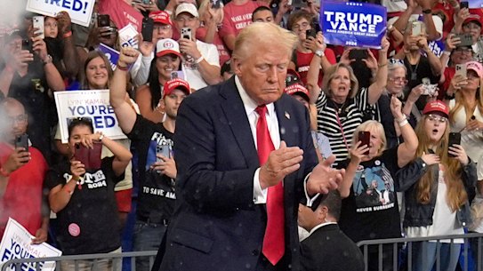Former president Donald Trump arrives to speak at a campaign rally at Georgia State University in Atlanta.